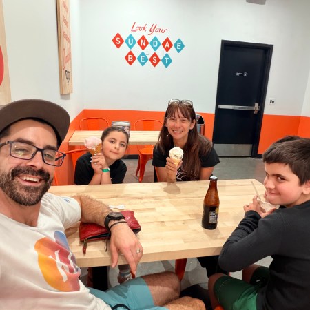 Adam Nicole Avilene and Jake at an ice cream shop on Mother's Day — the Adventures We Seek family enjoying one of their last sweet moments together in Kansas before flying to Norway in 10 days.