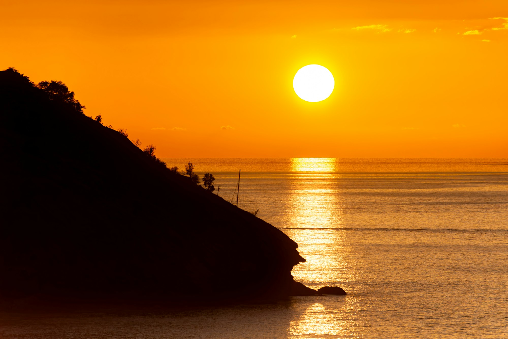 The sun setting over the water near St John, Antigua