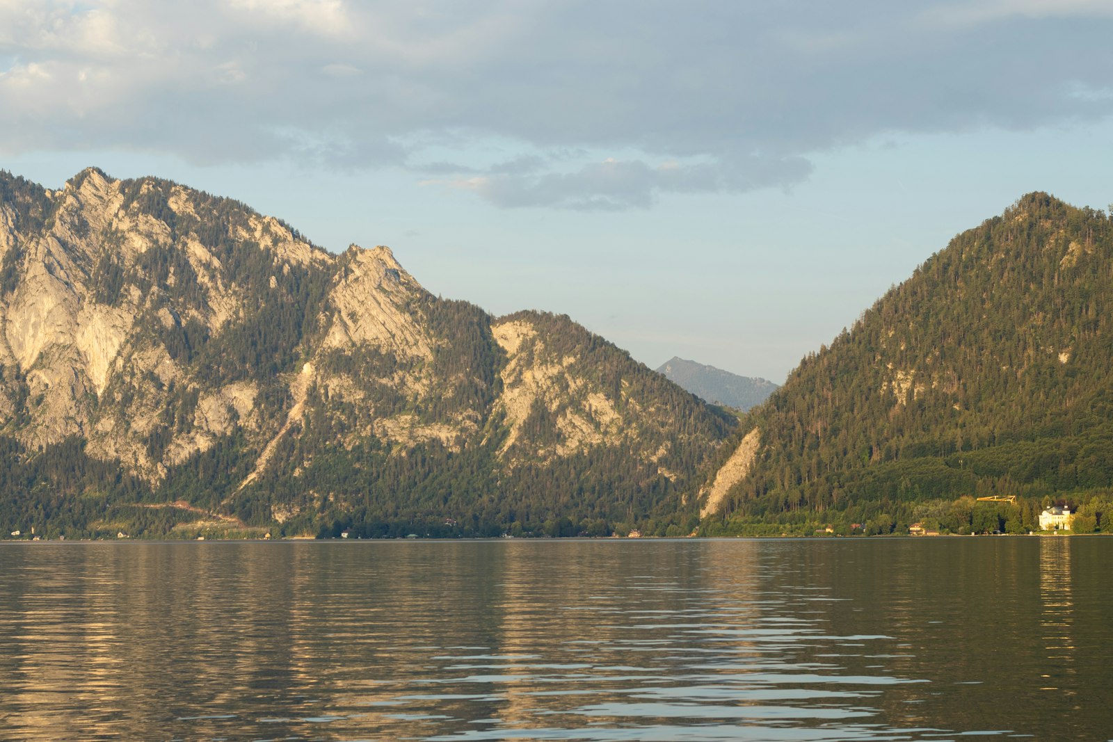 A still alpine lake ringed by rocky mountains near Zell am See