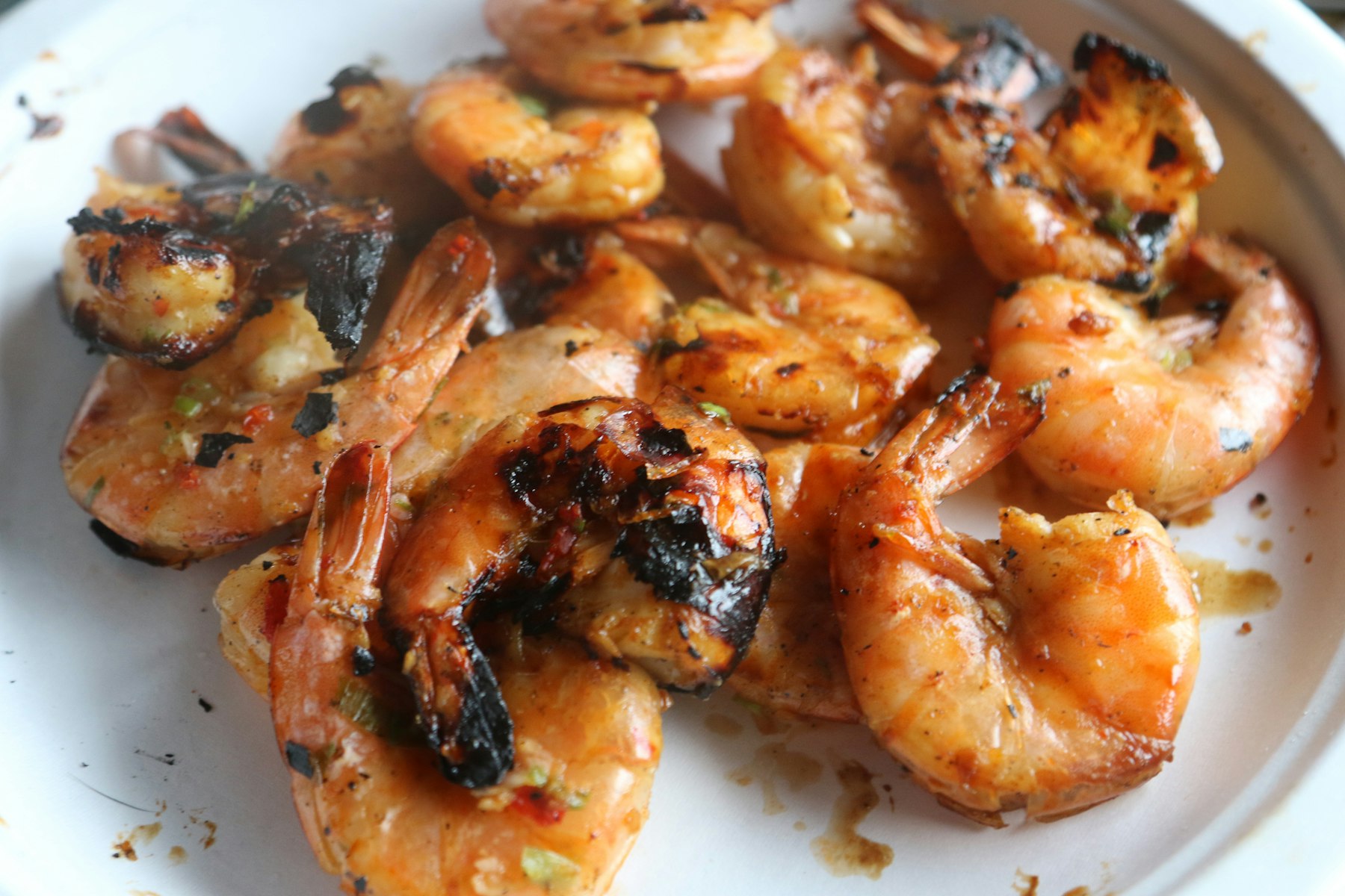 Grilled prawns on a white plate