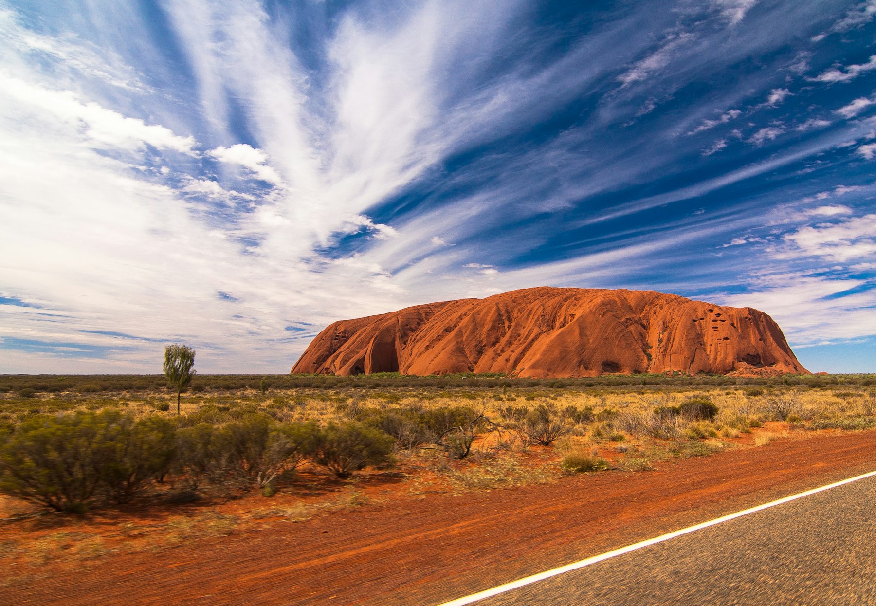 Uluru rising above the red desert in the Northern Territory Australia