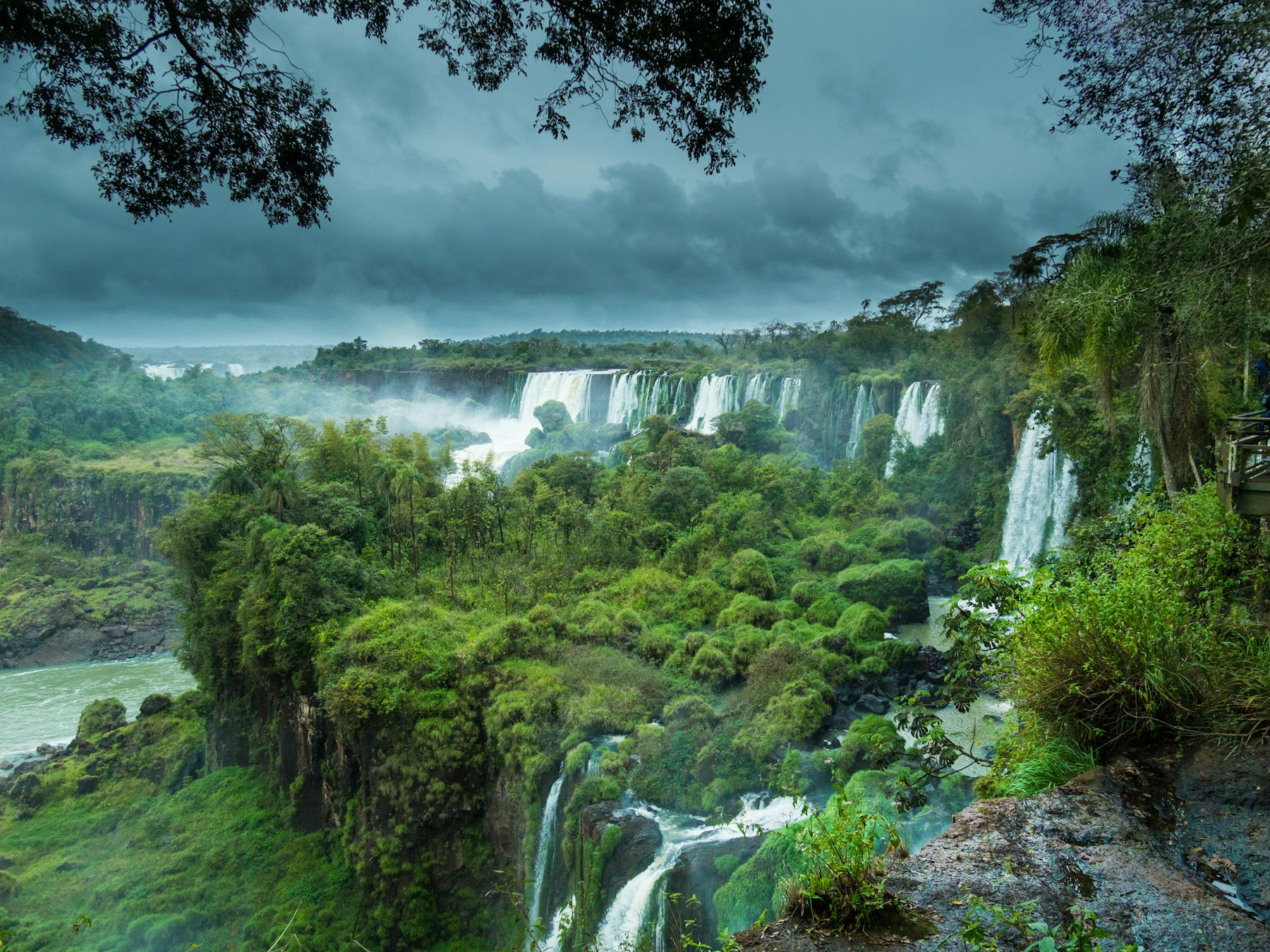 The Iguazu Falls dropping through rainforest on the Brazil Argentina border