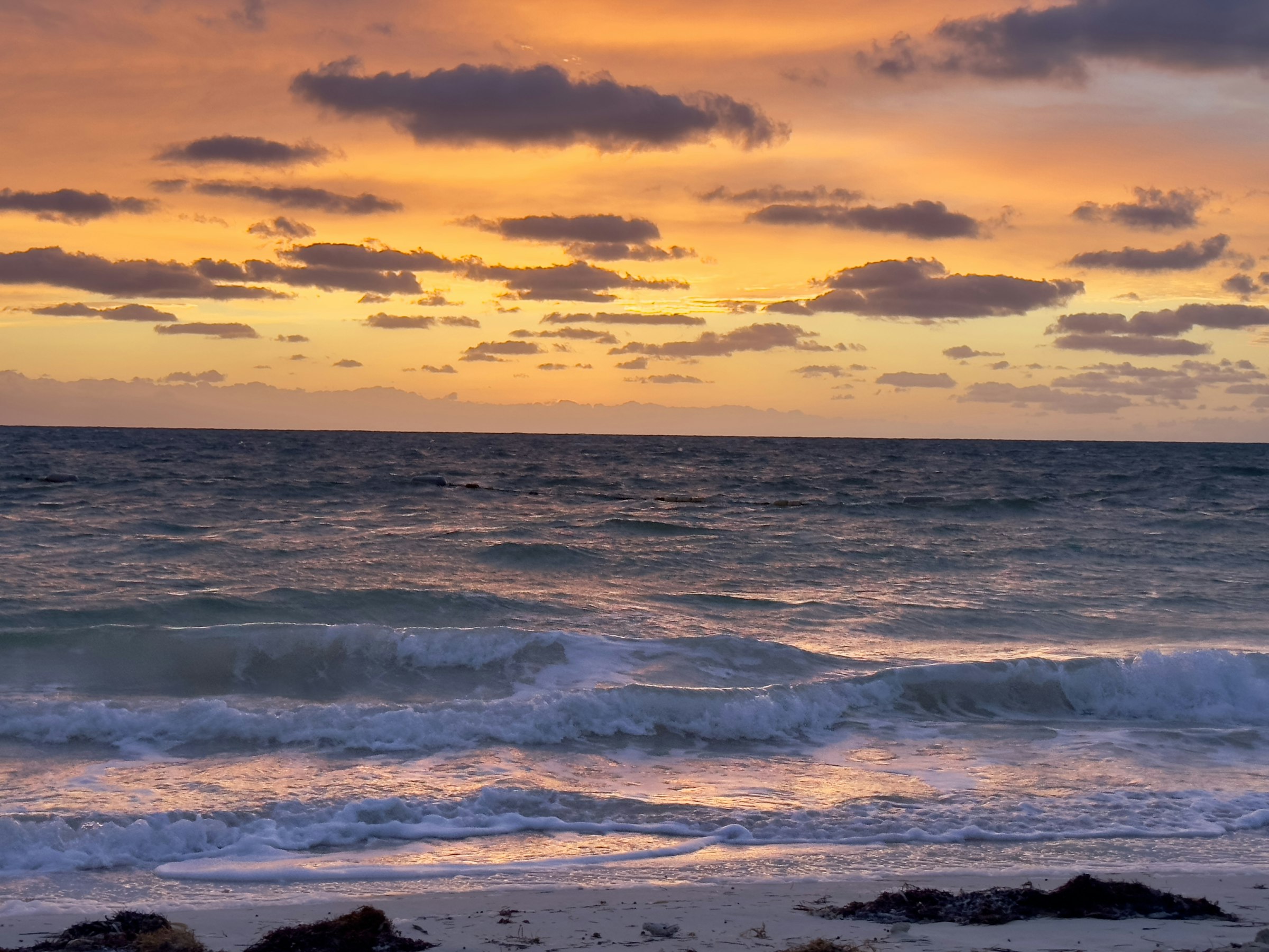 A sunset over the ocean off Andros Island
