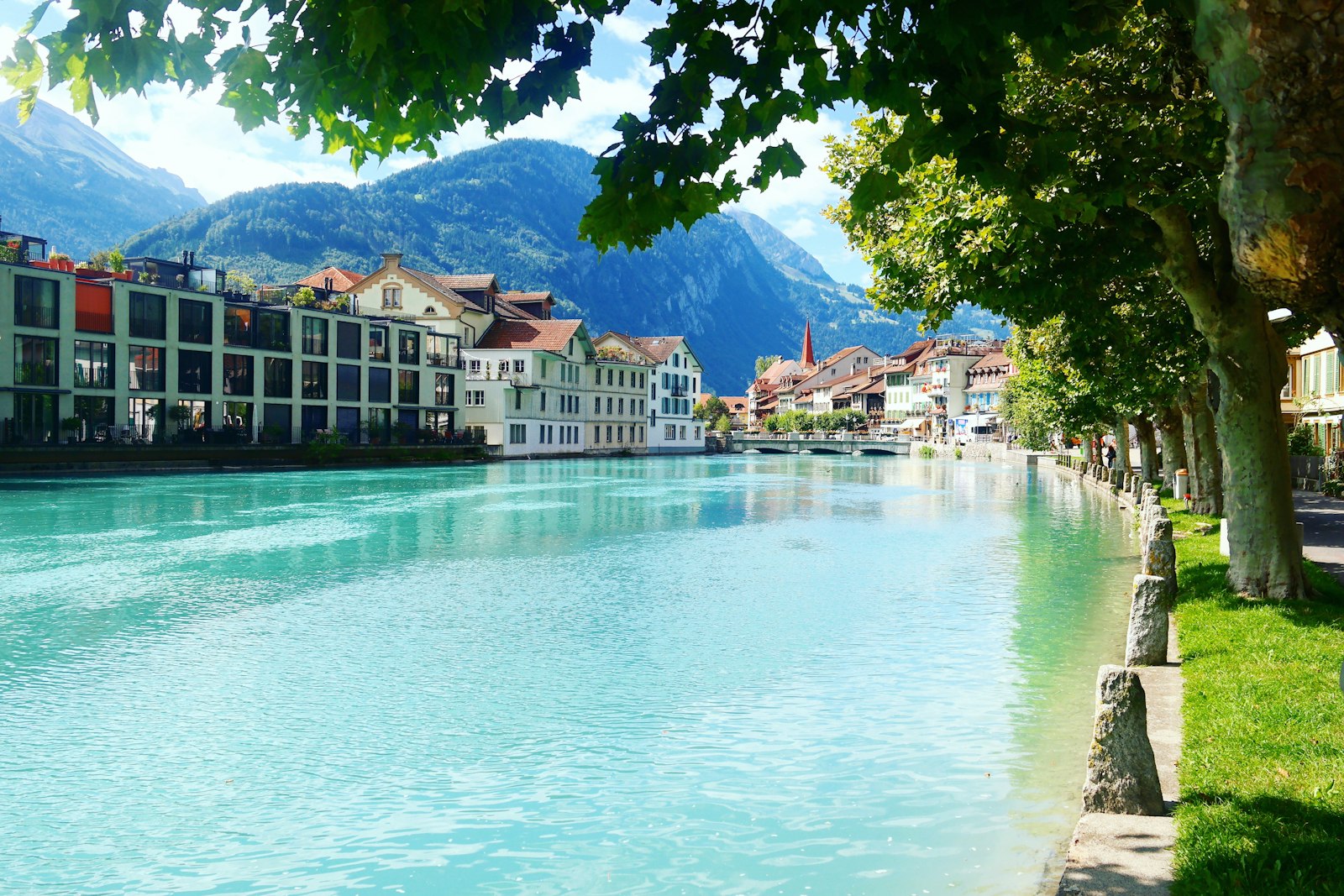 Turquoise river running past the town of Interlaken between two lakes