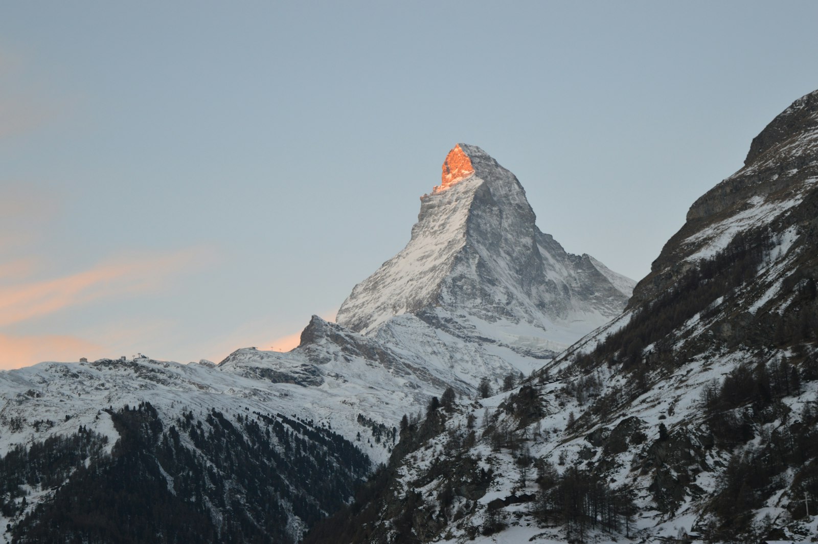 The Matterhorn lit by early light above the valley at Zermatt