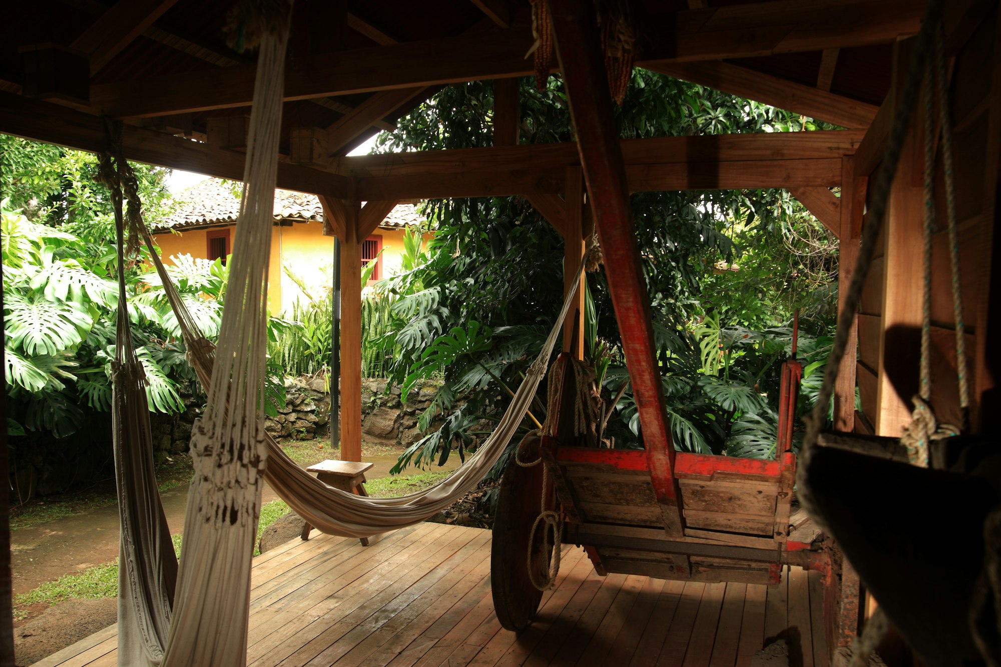 Woven hammocks strung across the open wooden terrace of a jungle lodge in Costa Rica