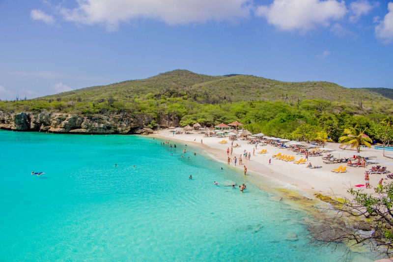 People on the sand at Grote Knip, also called Playa Kenepa, in Curacao