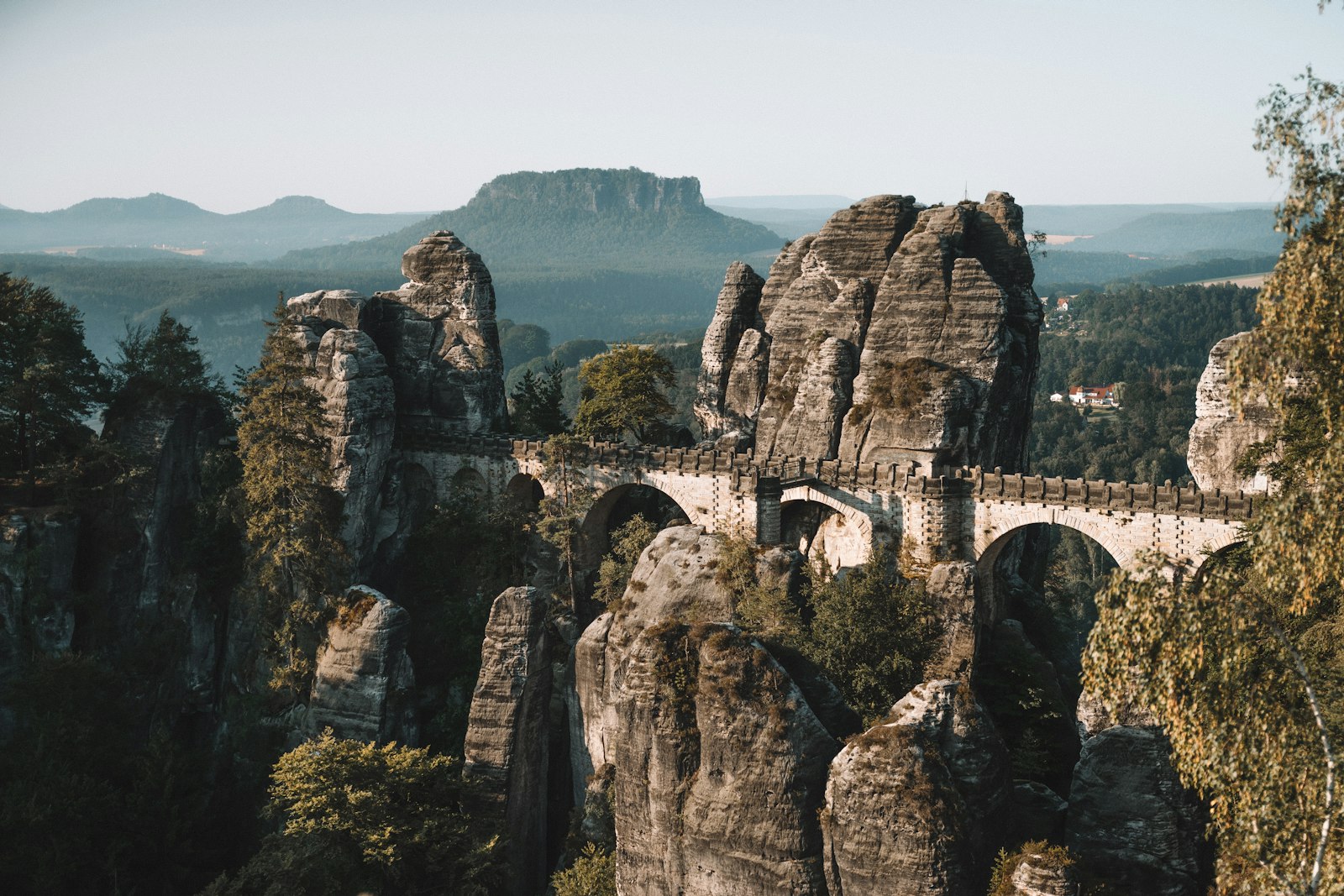The Pravcice Gate sandstone arch above the forest in Bohemian Switzerland
