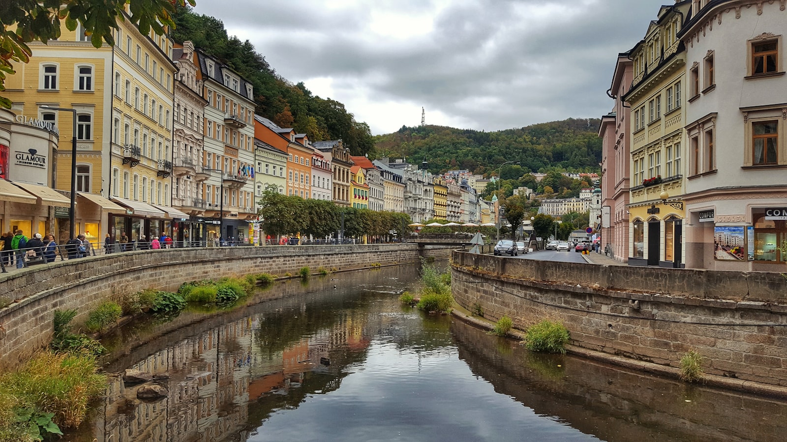 Pastel spa buildings lining the river through the centre of Karlovy Vary