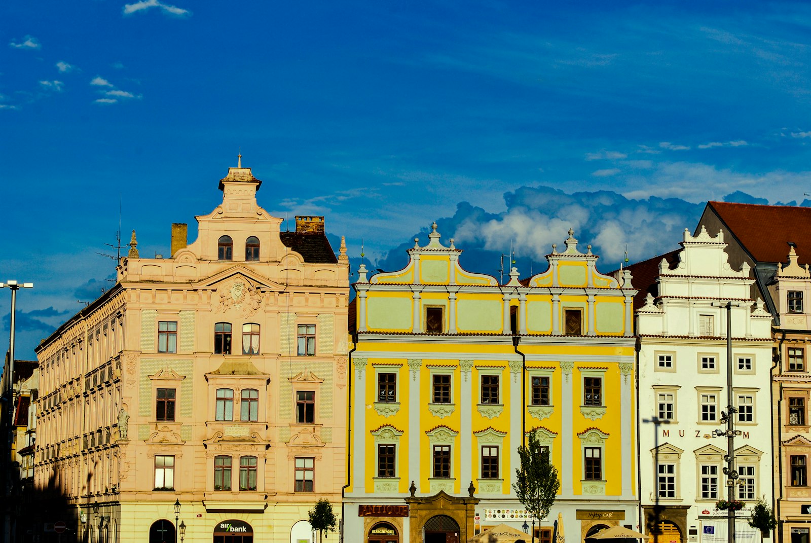 Yellow and cream baroque houses along the main square in Pilsen