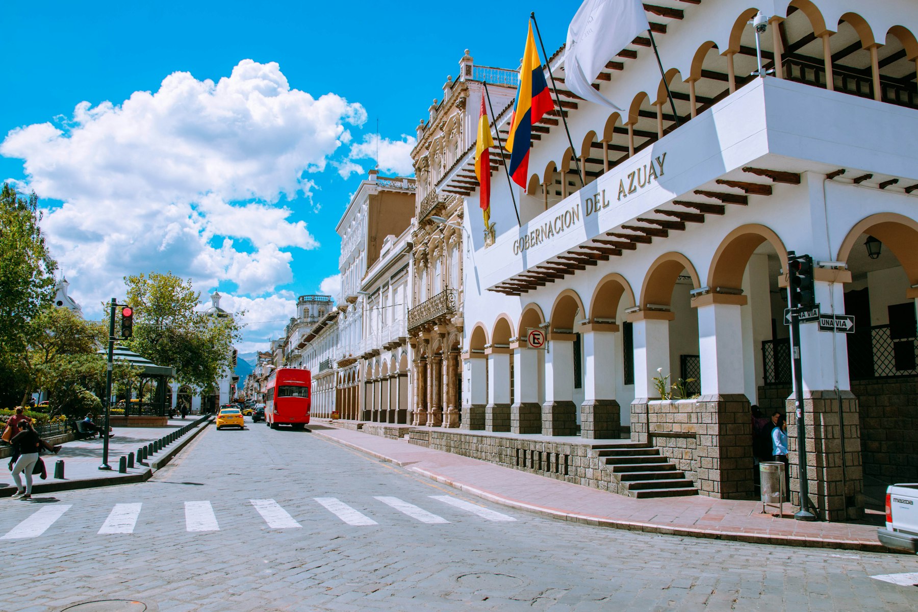 A white colonial arcade on a street in Cuenca Ecuador