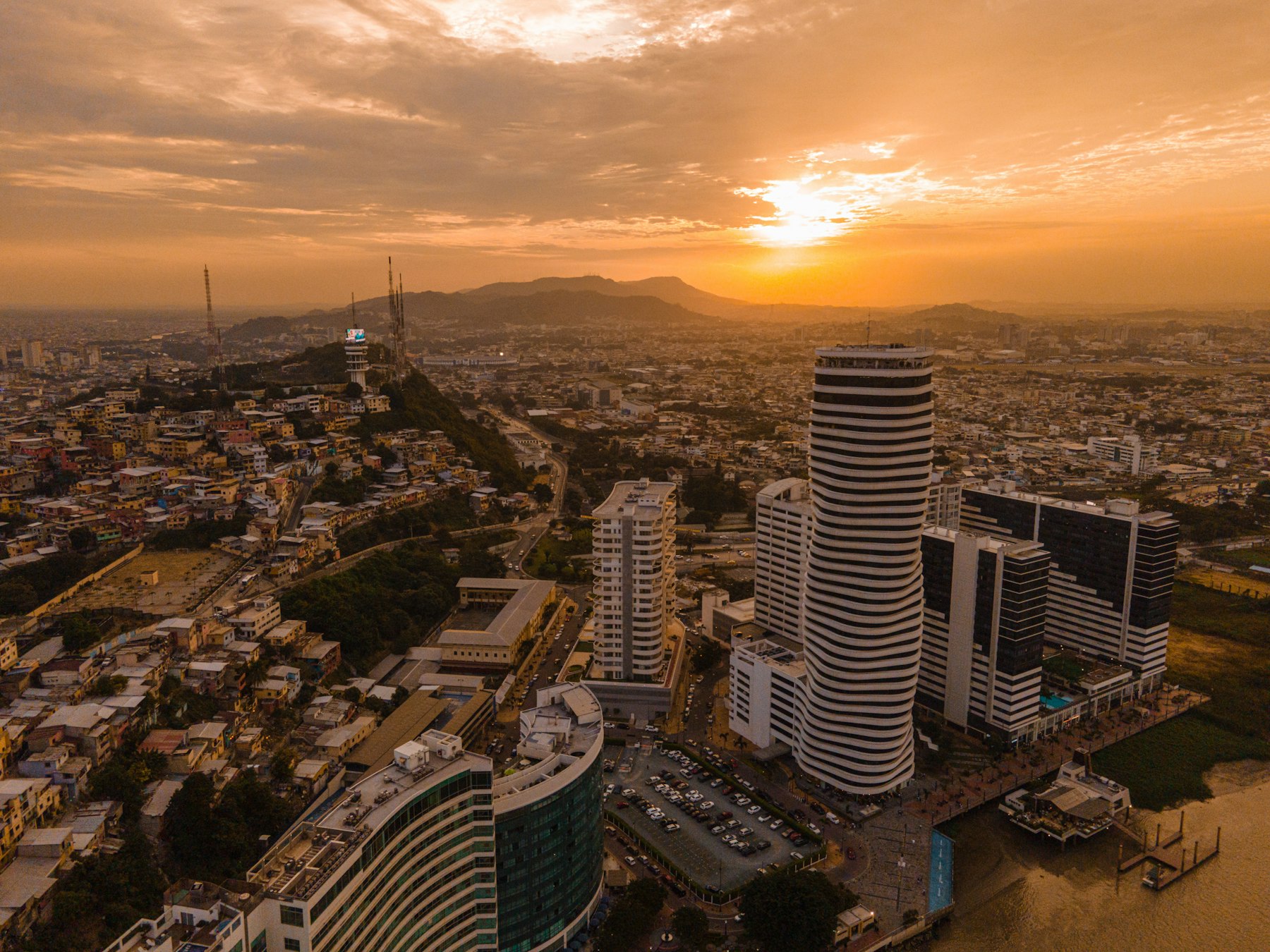 The skyline of Guayaquil Ecuador at sunset beside the Guayas river
