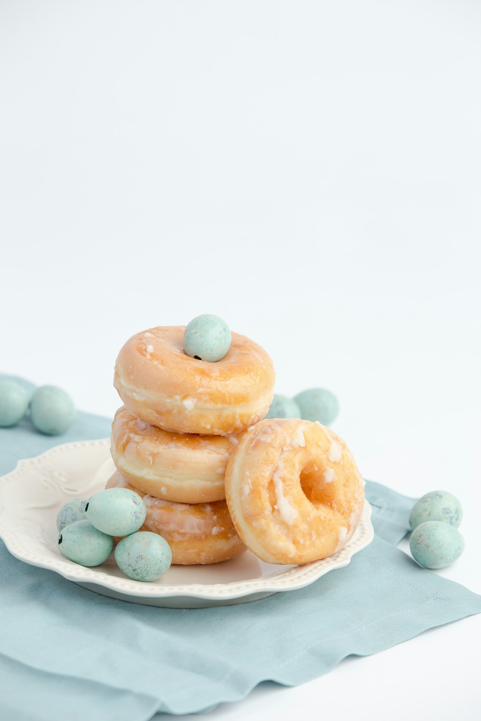Sugared doughnuts arranged on a plate
