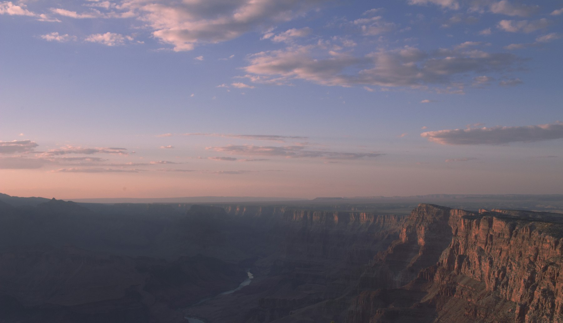 Dawn light over the Grand Canyon with the Colorado River far below