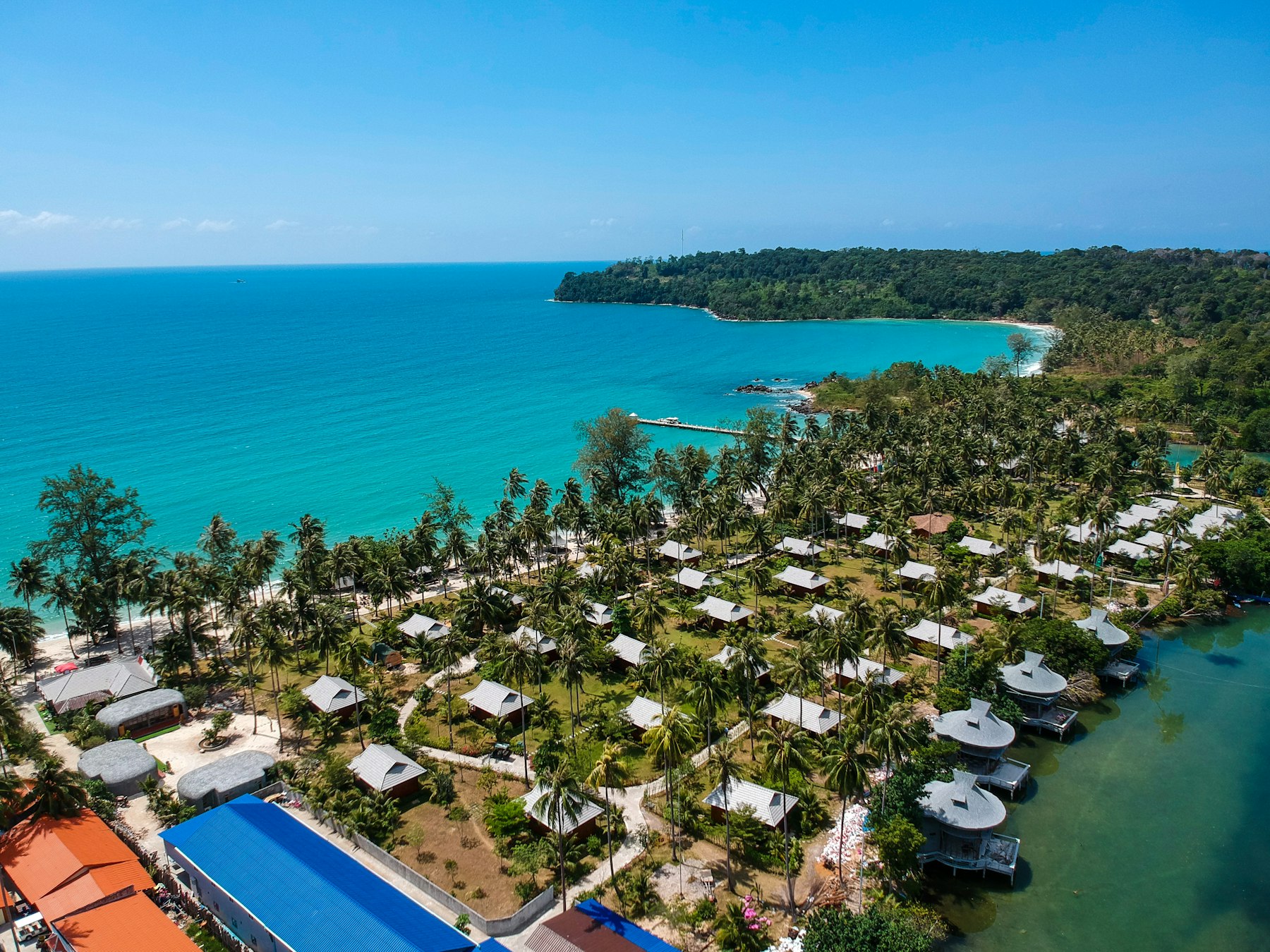 Palm covered coastline and turquoise water seen from above on the Cambodian coast near Sihanoukville