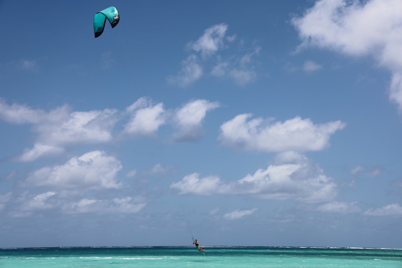 A kite surfer over open water at Barkers National Park in West Bay, Grand Cayman