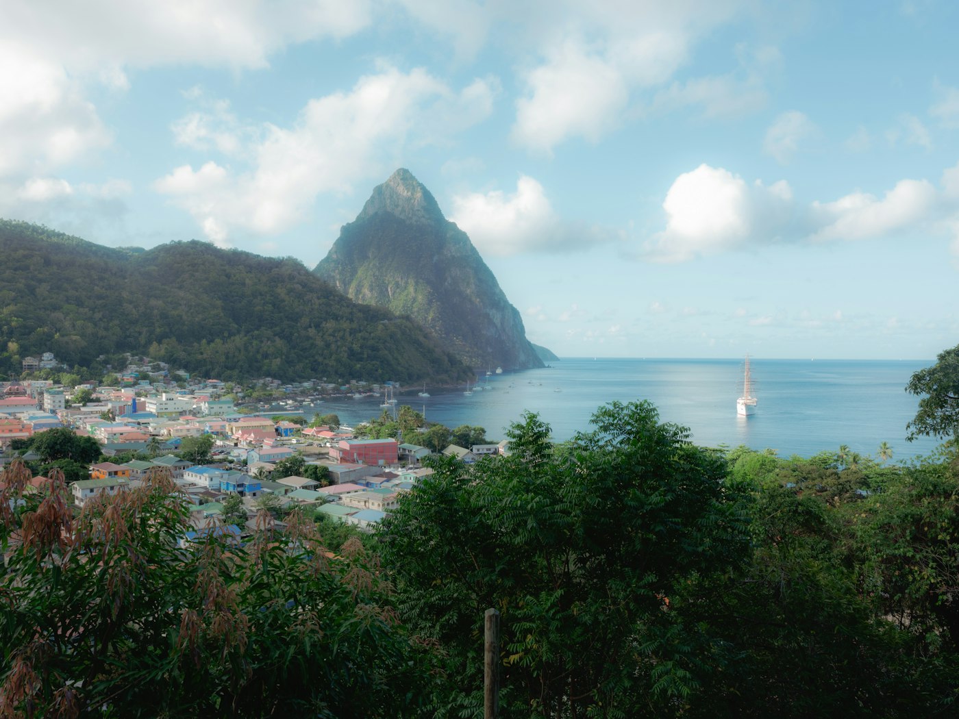 The town of Soufriere spread along the bay below Petit Piton on Saint Lucia