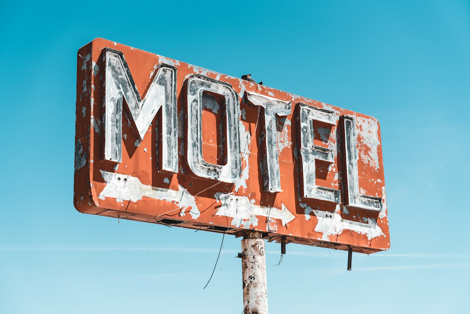A weathered vintage neon motel sign of the kind preserved in the Neon Museum boneyard