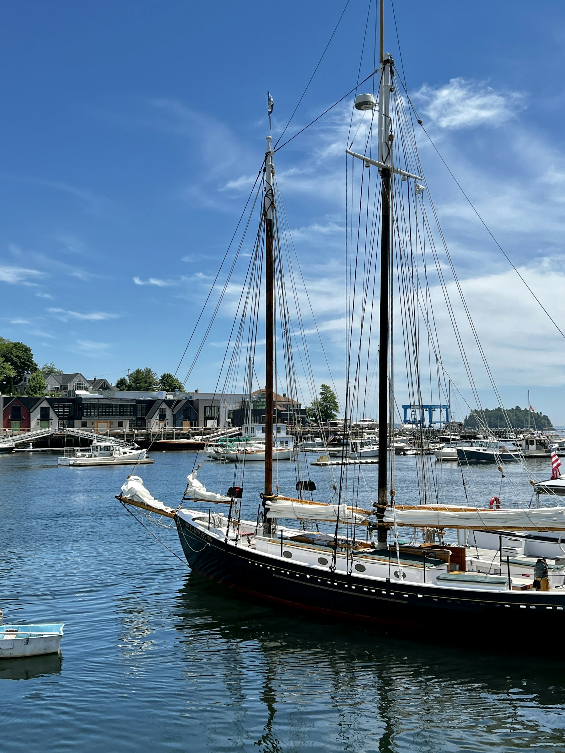 A tall masted windjammer schooner moored in Camden harbour Maine