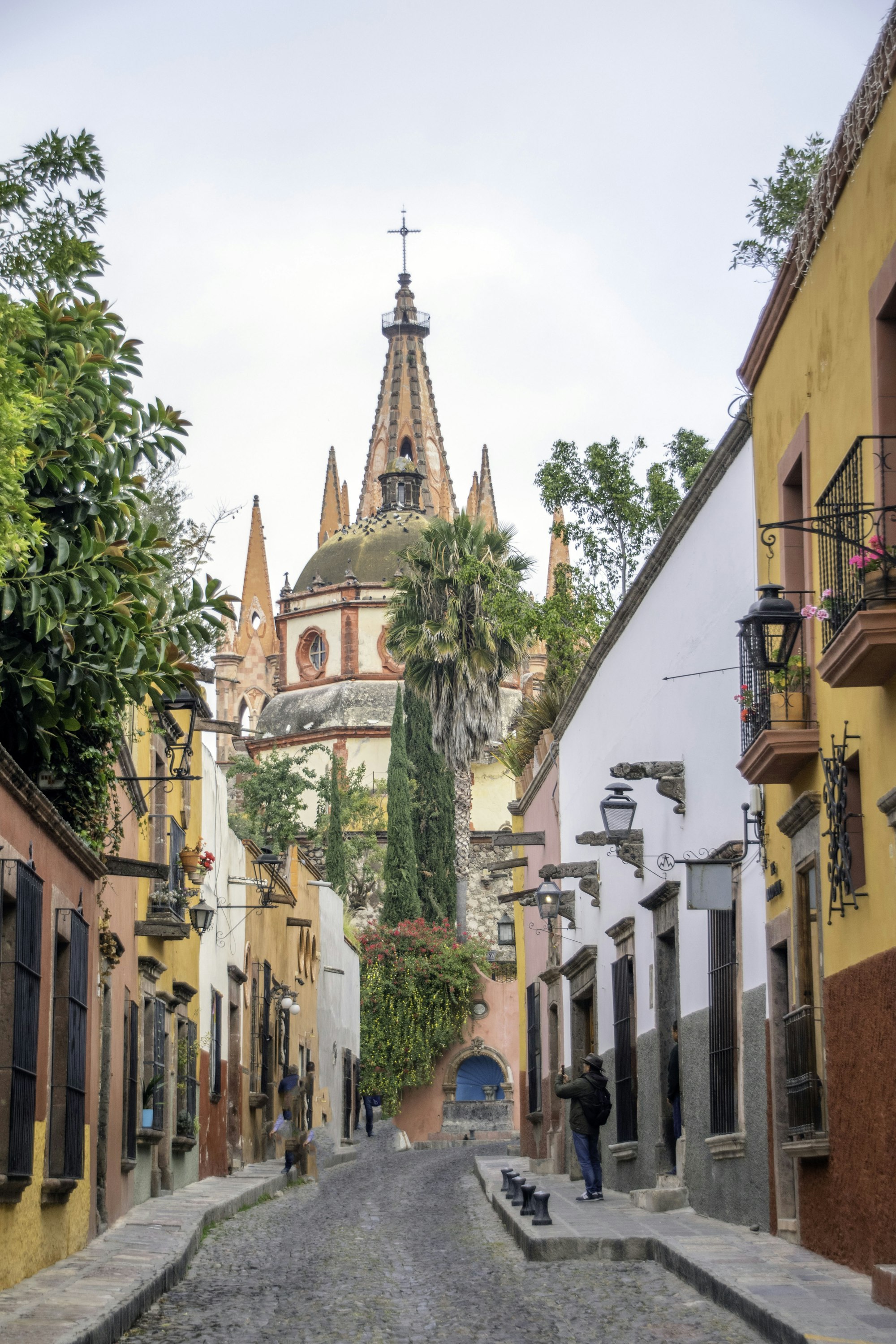 The pink stone spires of the Parroquia rising above the rooftops of San Miguel de Allende