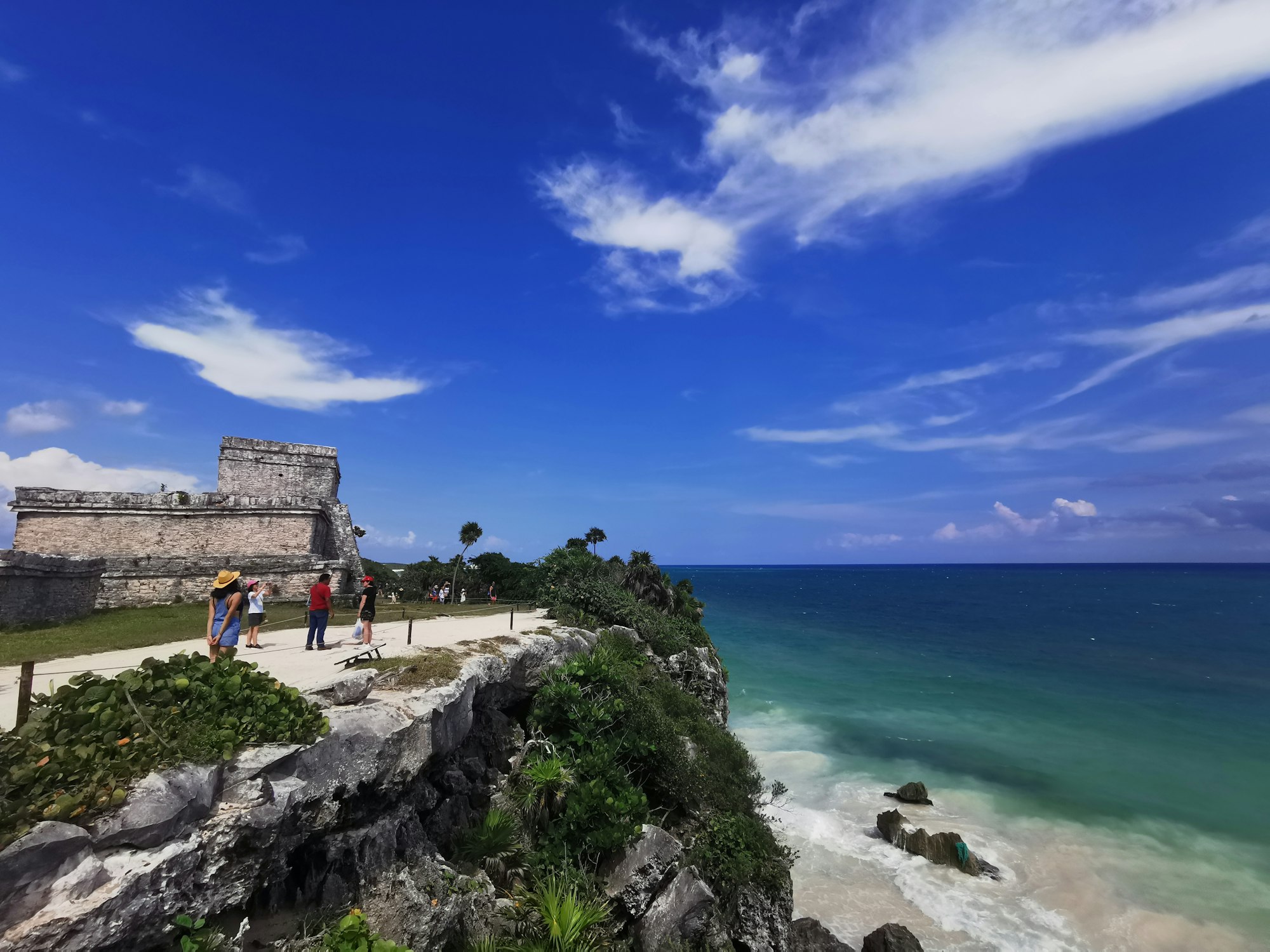 Mayan ruins at Tulum on a cliff above turquoise Caribbean water