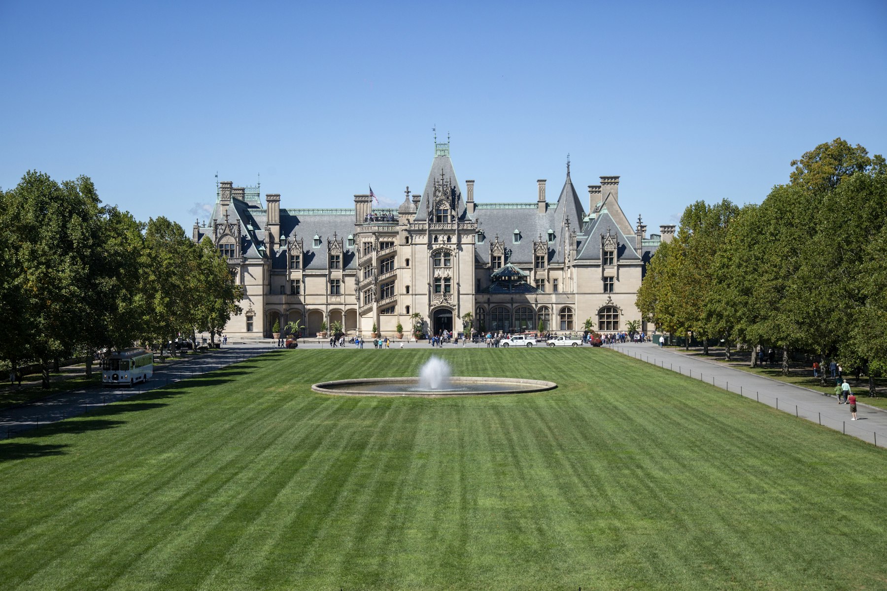 The Biltmore Estate house in Asheville North Carolina seen across a fountain and lawn