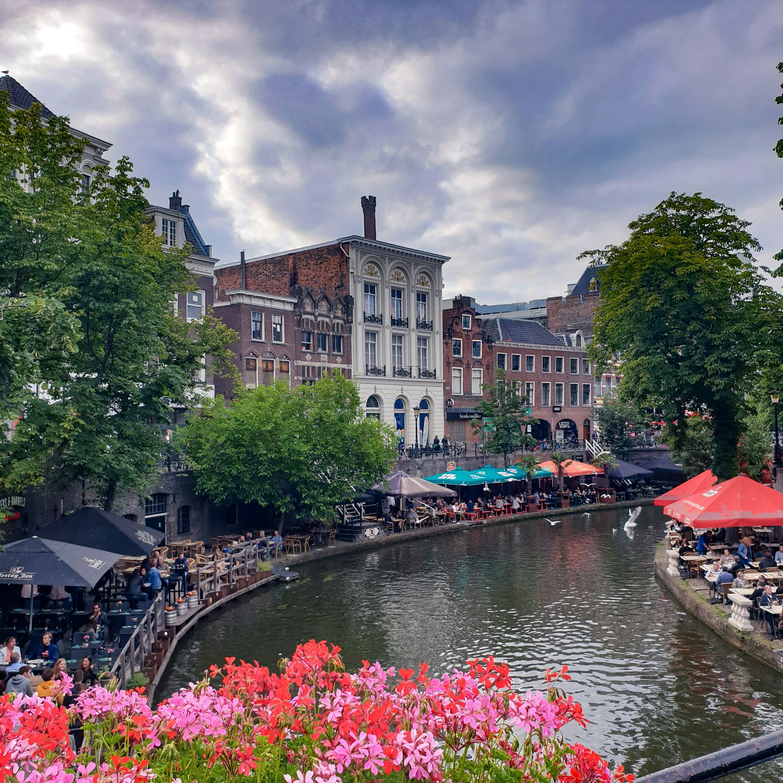 Cafe terraces on the sunken wharfs of the Oudegracht canal in Utrecht