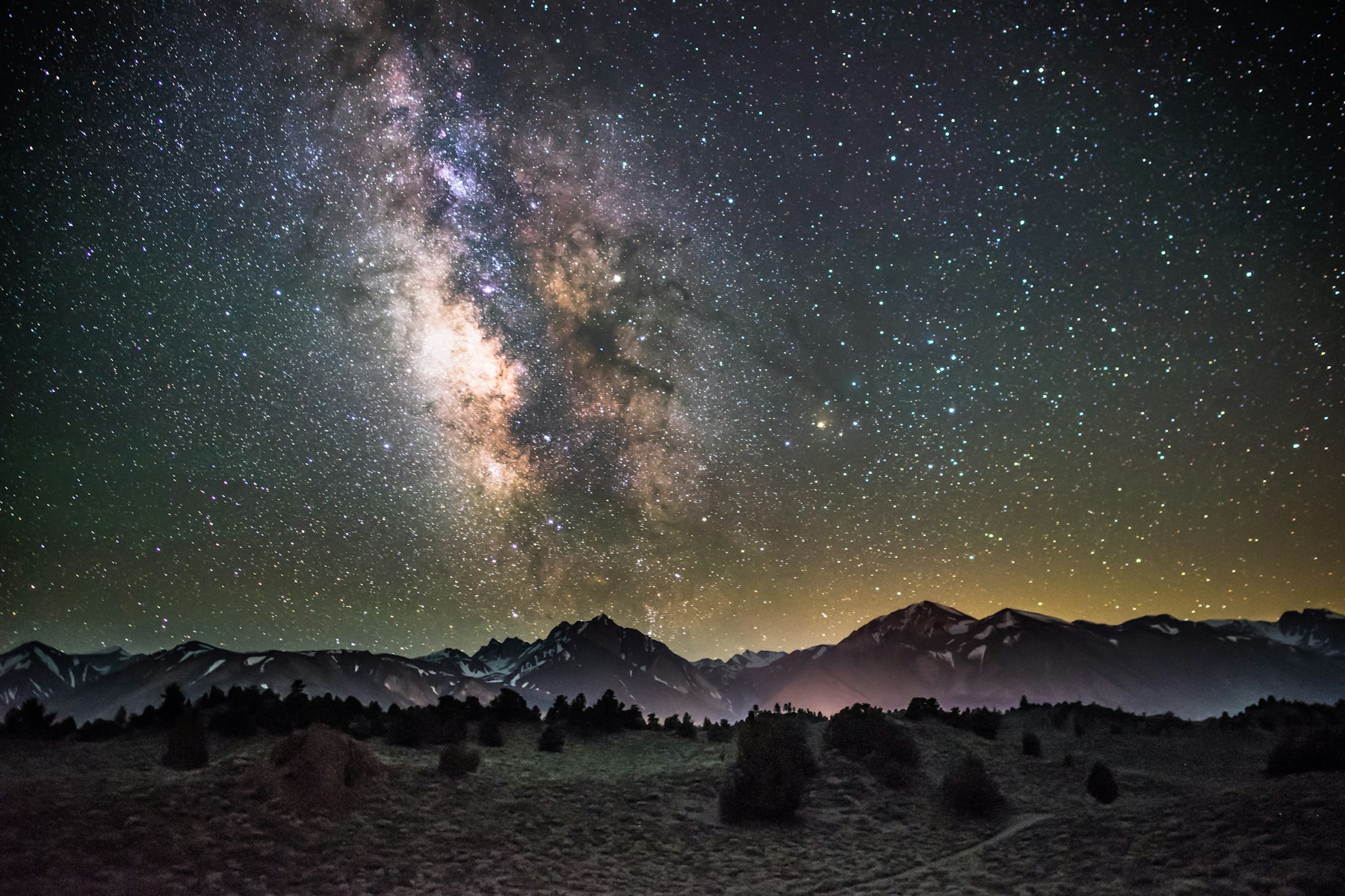 The Milky Way arching over dark desert mountains at Great Basin National Park Nevada