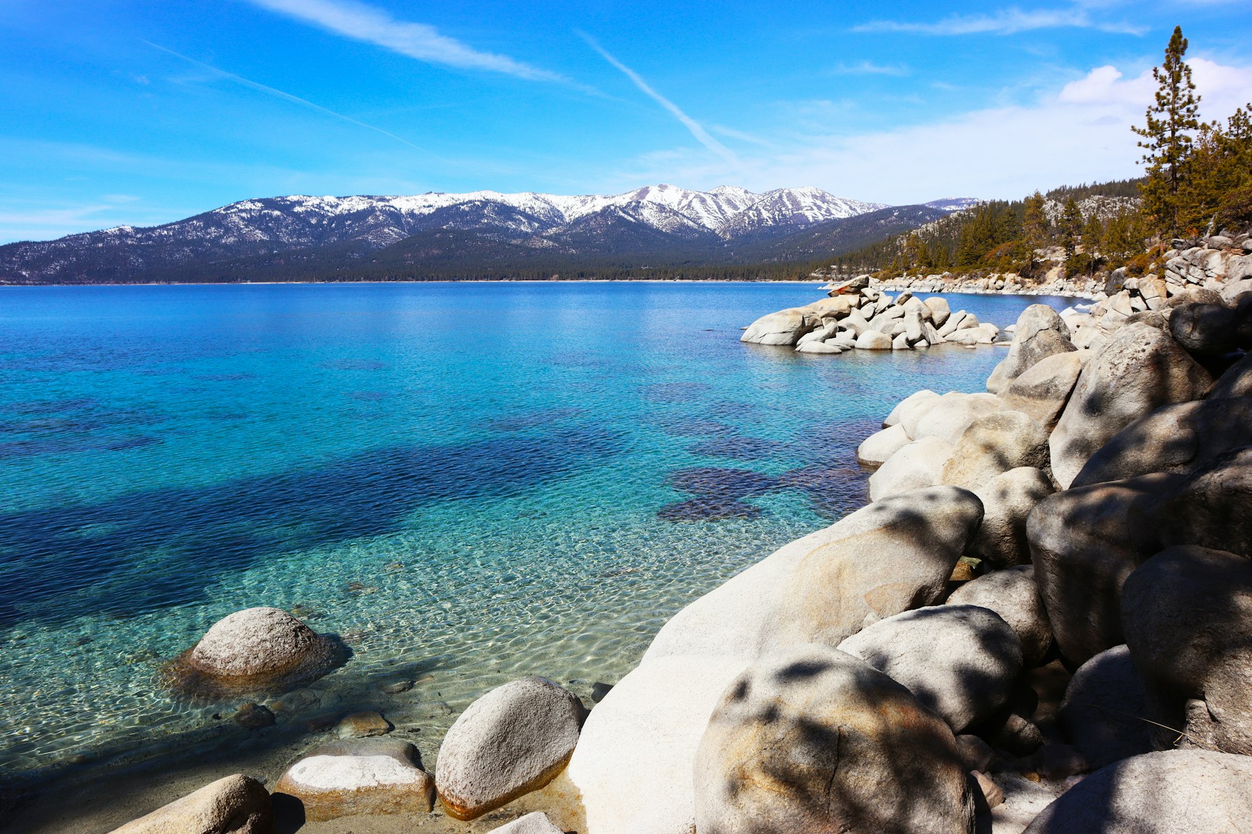 Granite boulders in clear turquoise water at Sand Harbor on the Nevada side of Lake Tahoe