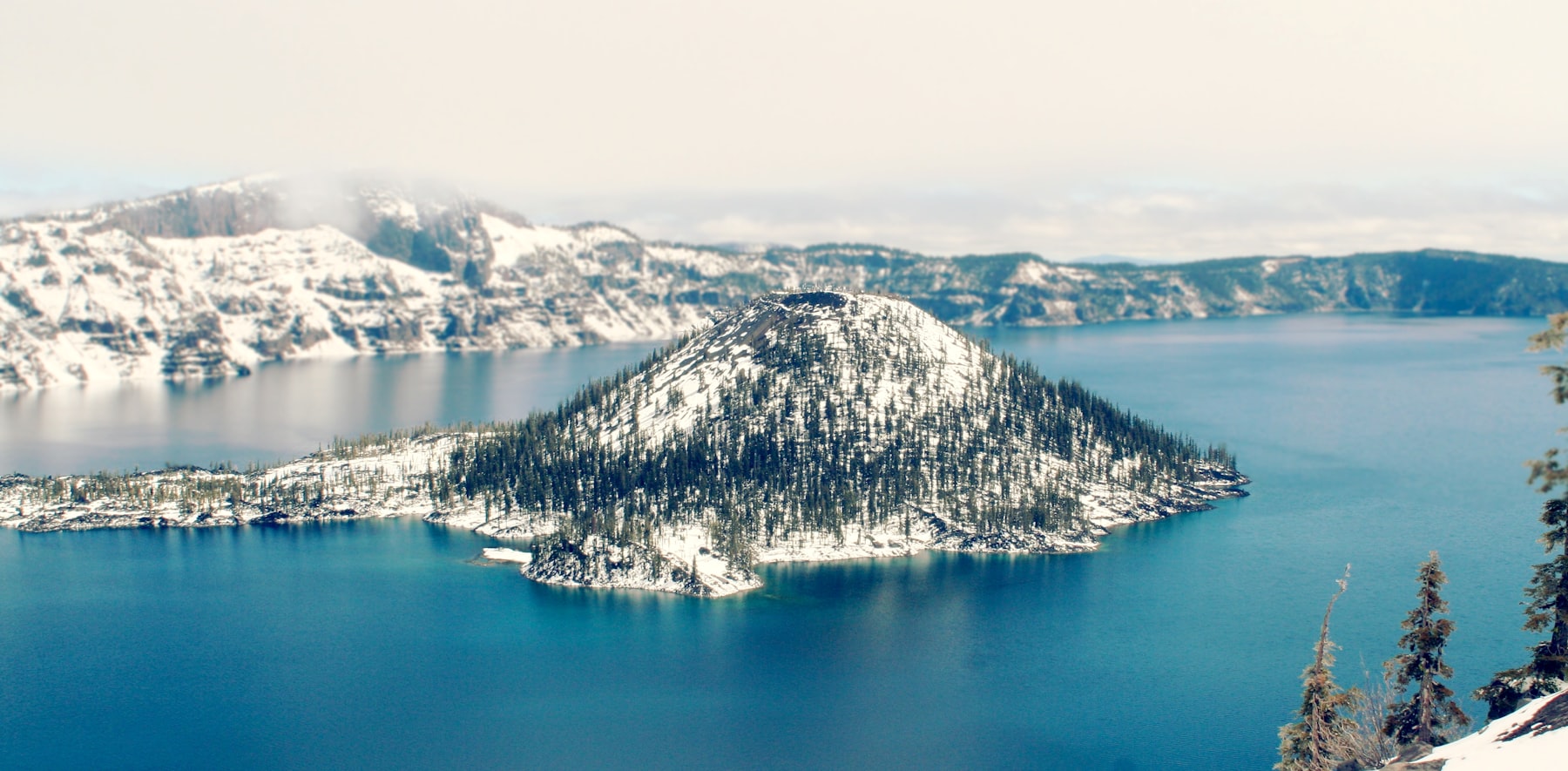 Snow covering Wizard Island and the rim of Crater Lake Oregon