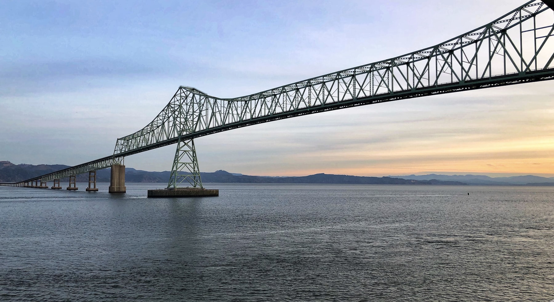 The Astoria Megler Bridge crossing the Columbia River at sunset in Oregon