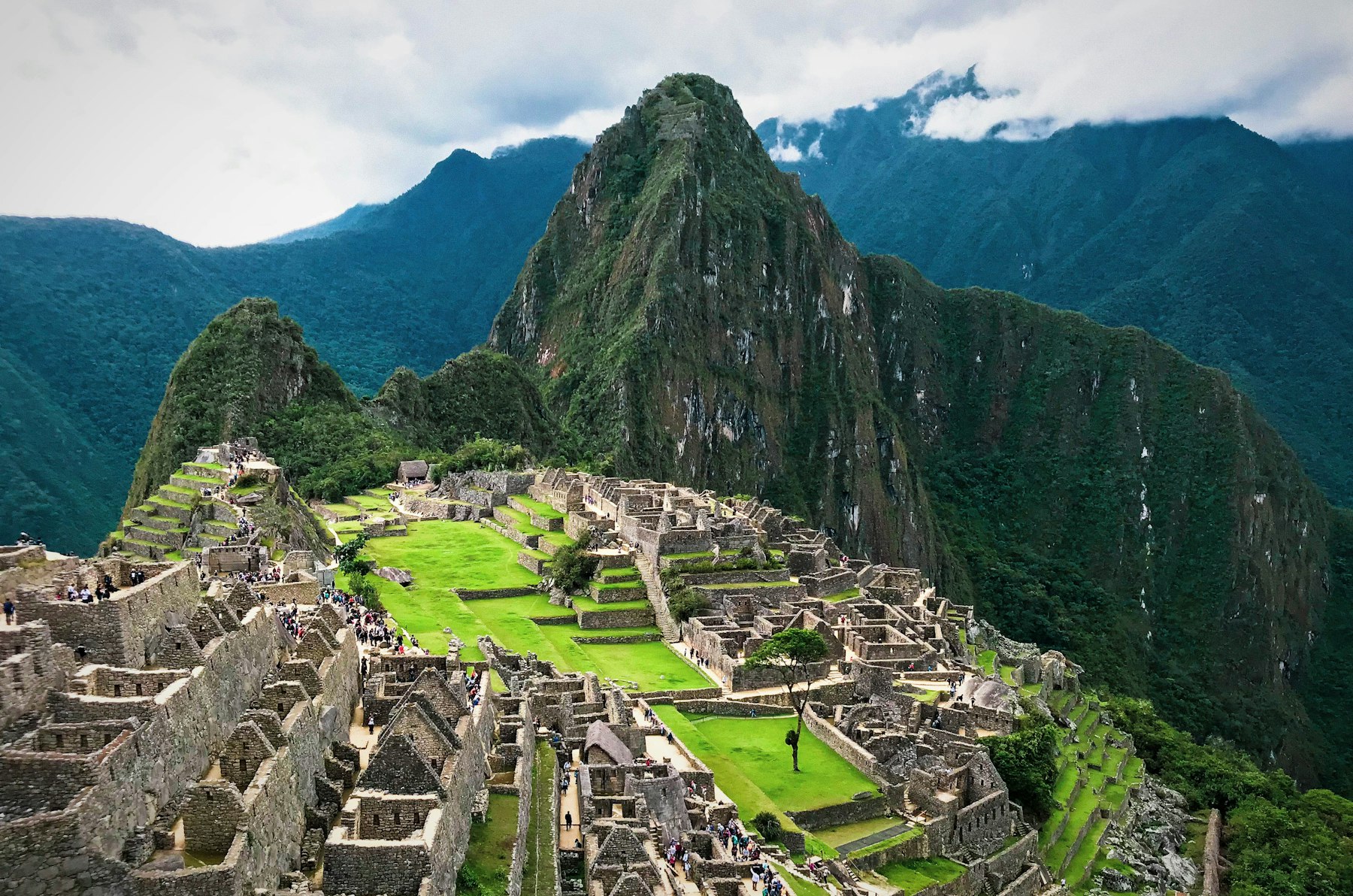 The stone terraces and ruins of Machu Picchu below Huayna Picchu mountain
