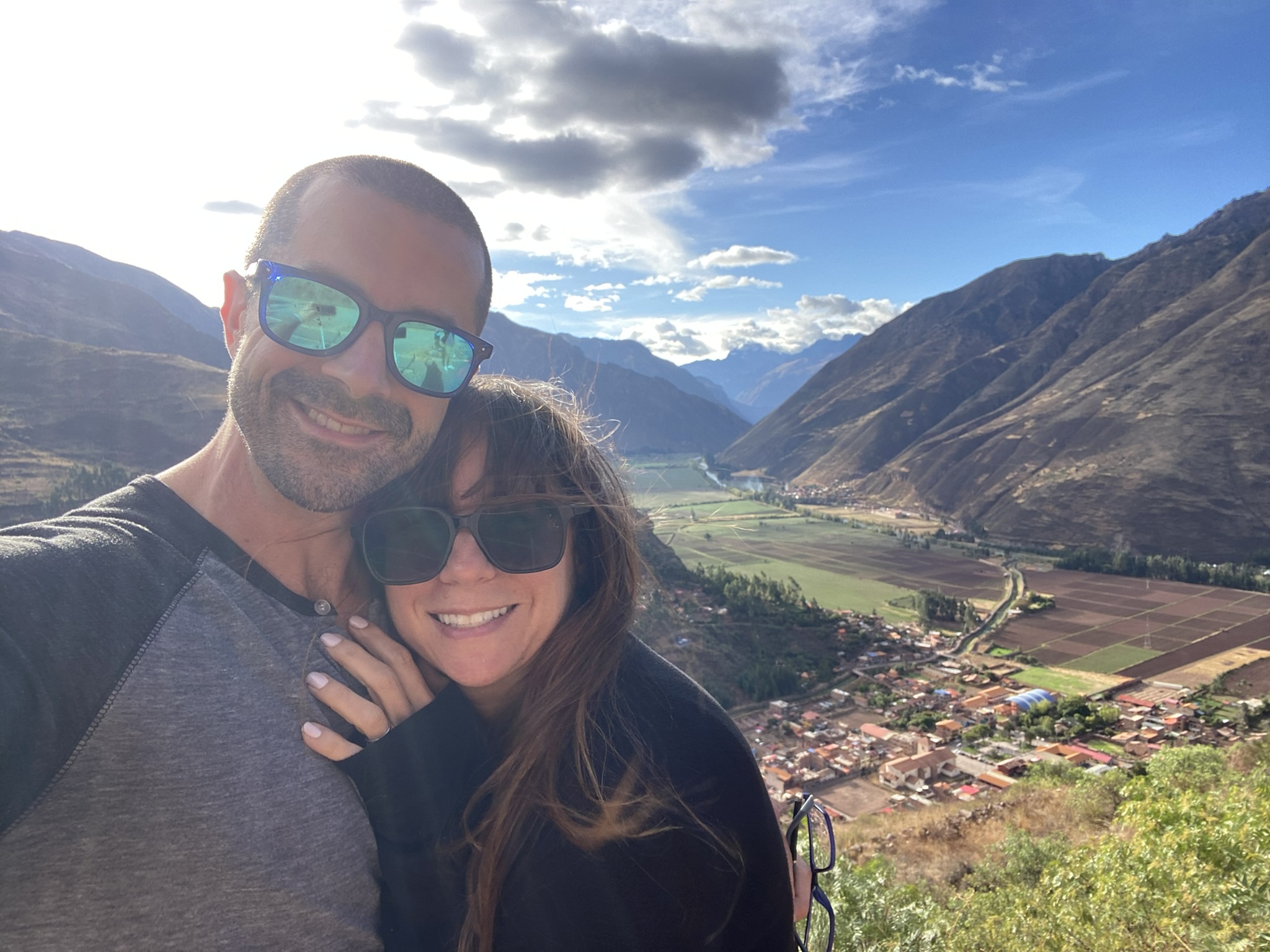 Nicole and Adam Damiano at a viewpoint over the Urubamba valley in the Peruvian Andes