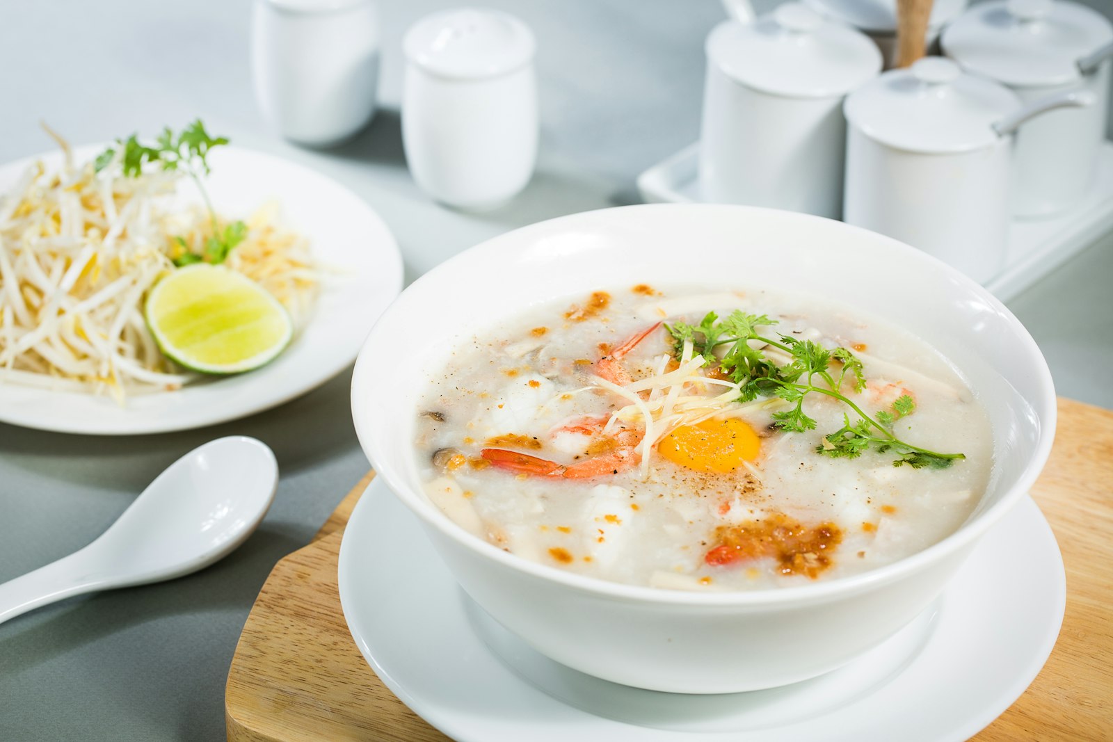 A bowl of creamy white sour rye soup with sausage and egg