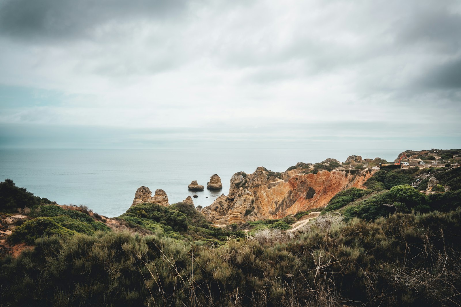Rocky headlands and cliffs dropping into a grey green Atlantic on the Portuguese coast