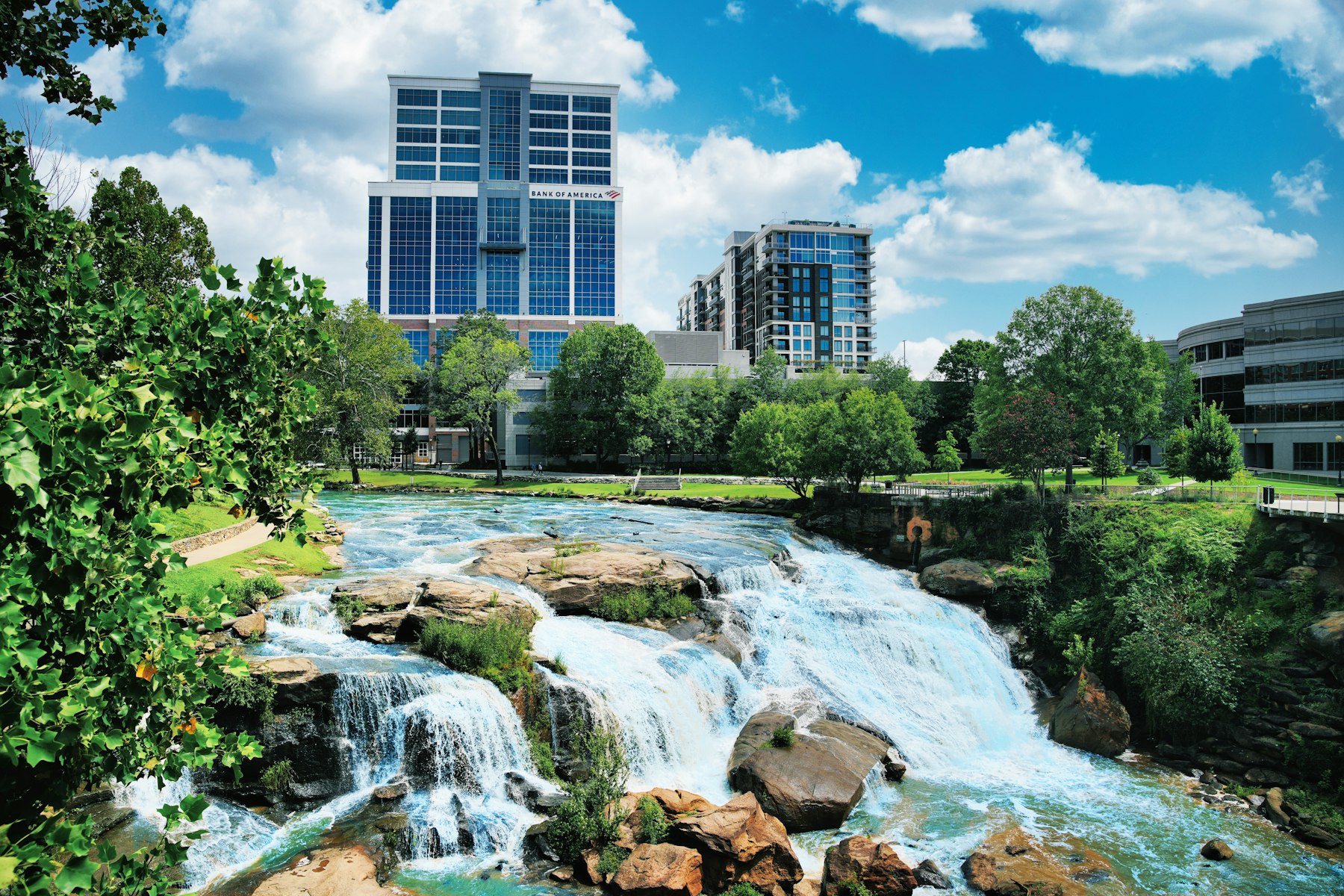 Waterfalls on the Reedy River in Falls Park with downtown Greenville South Carolina behind