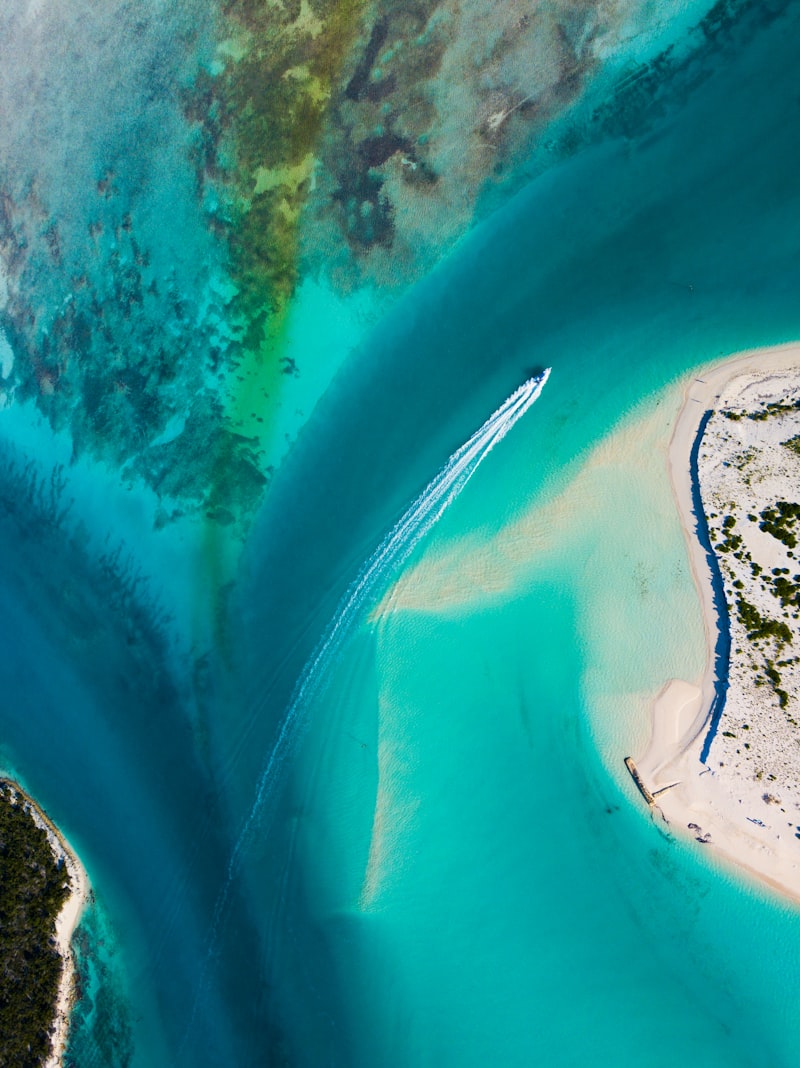 An aerial view of shallow turquoise water in the Turks and Caicos Islands