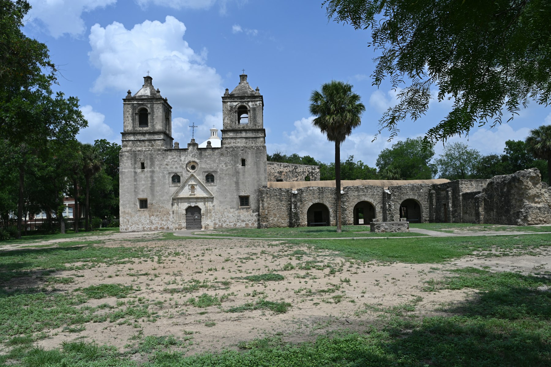 A Spanish colonial stone mission church with twin bell towers in San Antonio Texas