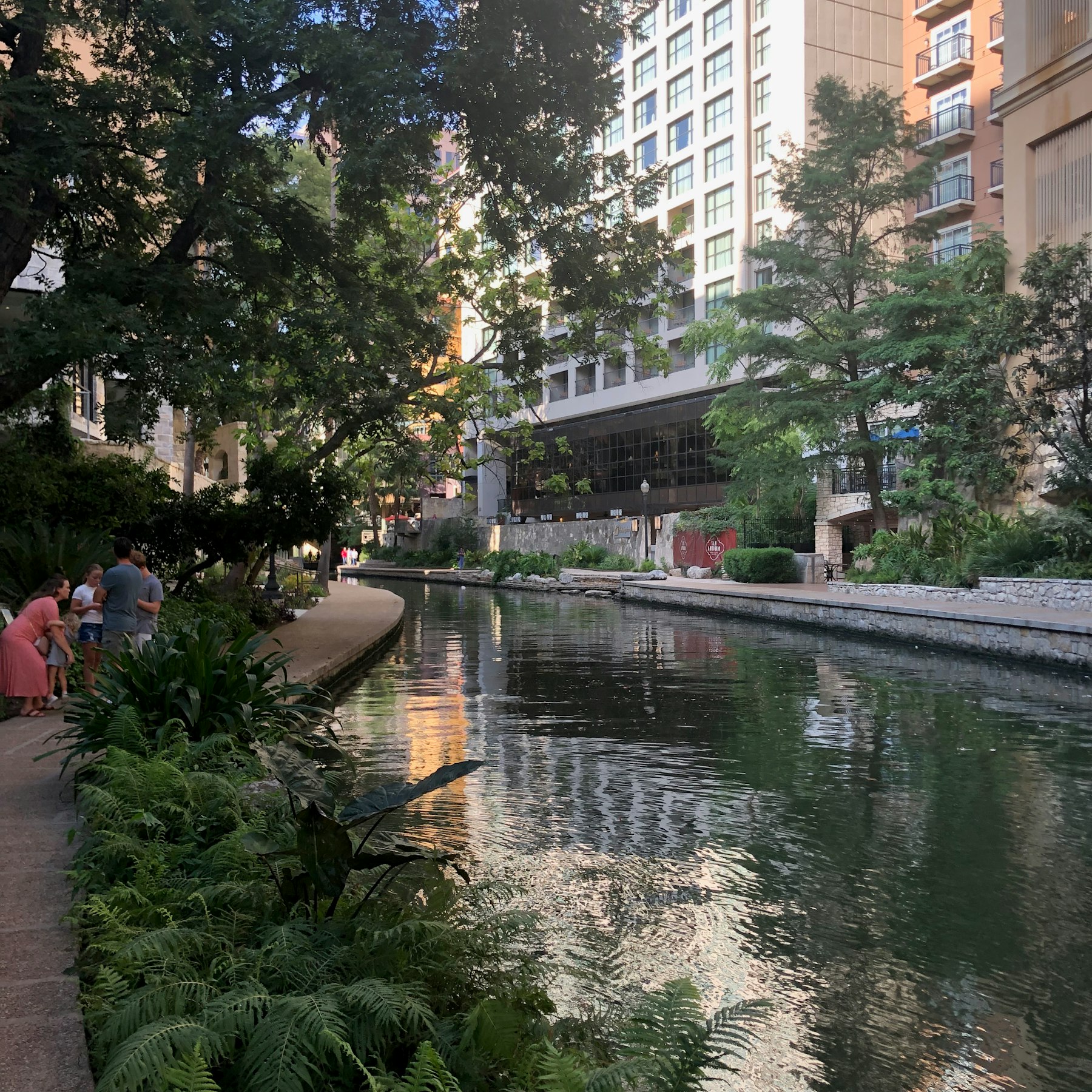 The San Antonio River Walk winding between buildings below street level