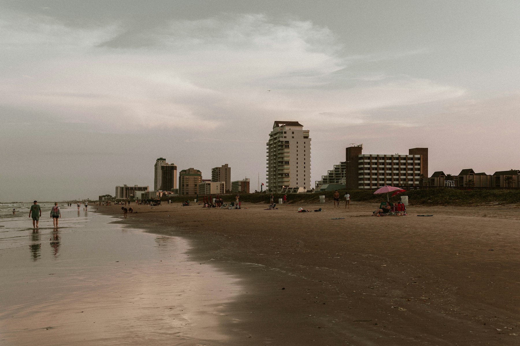 A wide sandy beach backed by condo towers at South Padre Island Texas