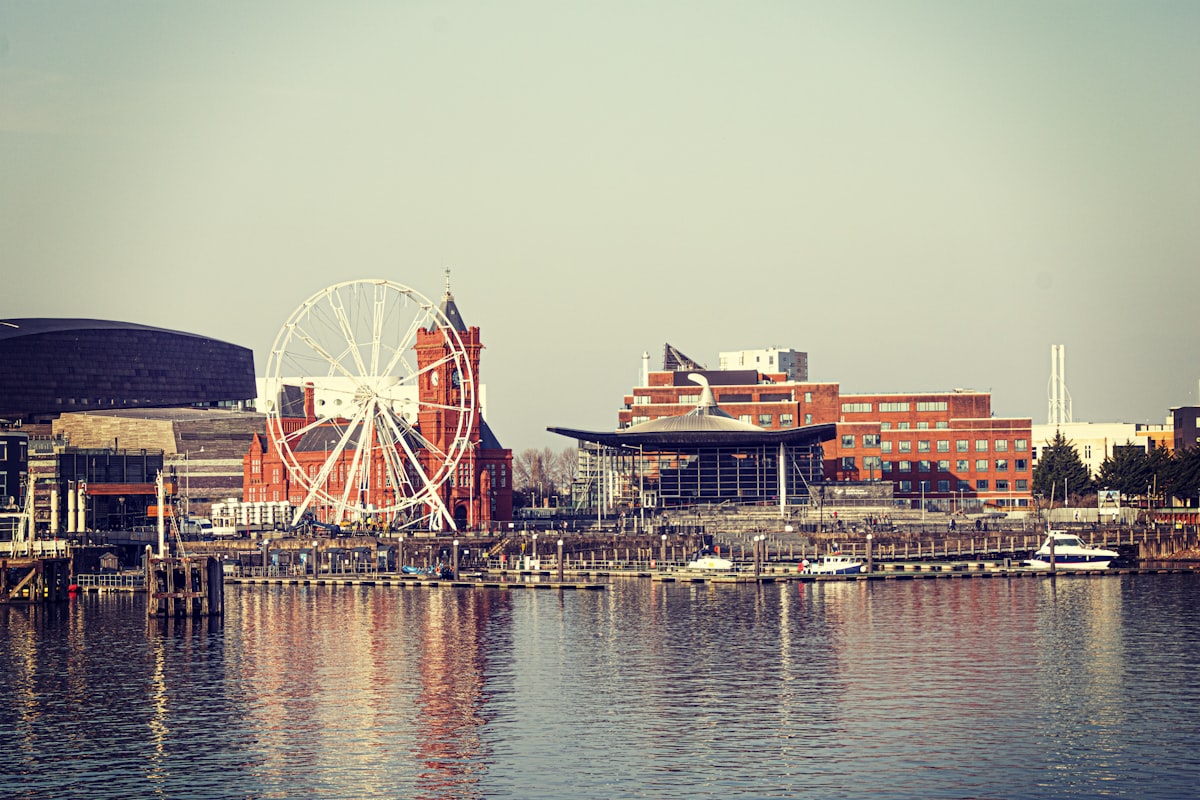 The waterfront at Cardiff Bay in Wales with the Pierhead building and boats on still water