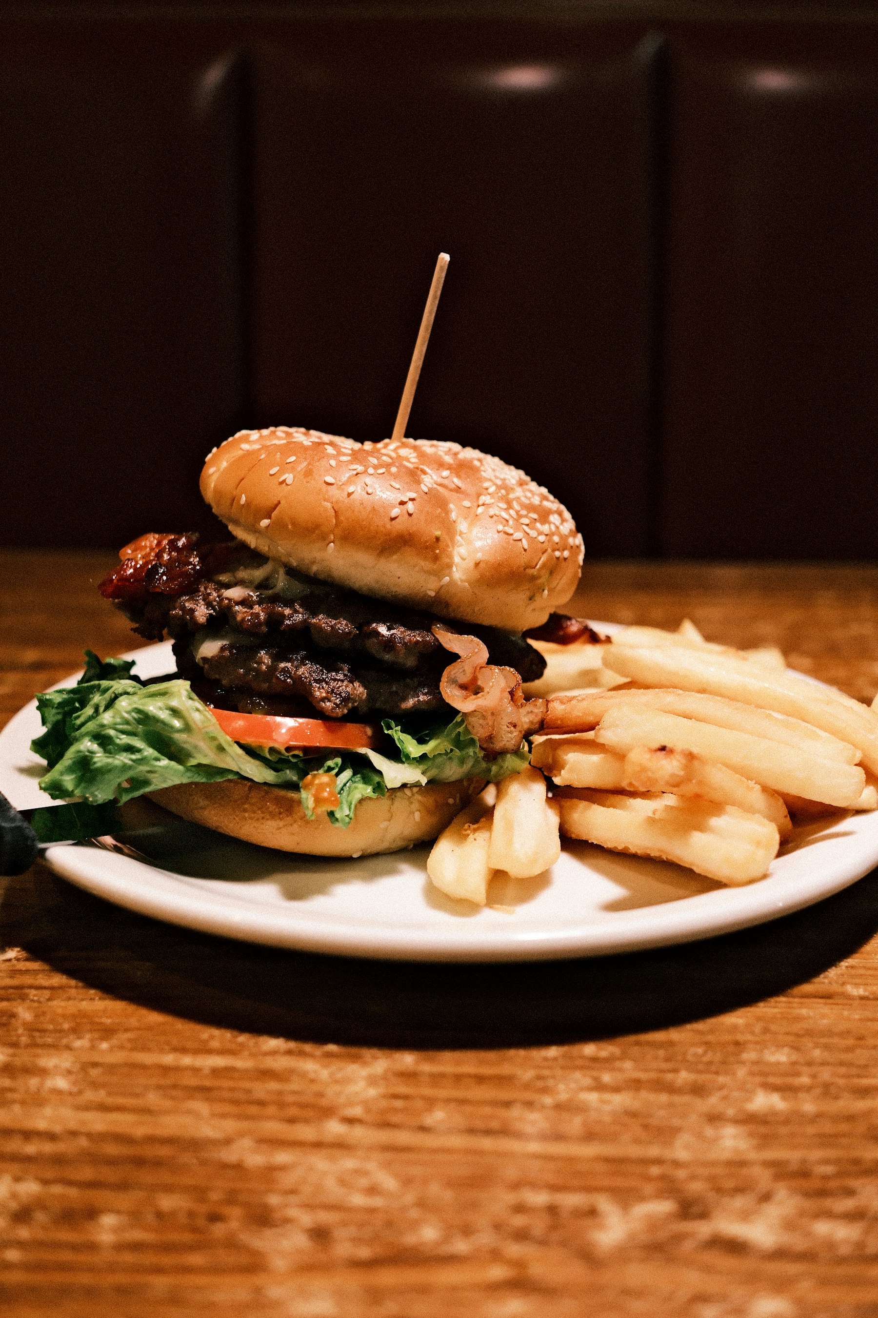 A cheeseburger and fries on a plate at an American diner