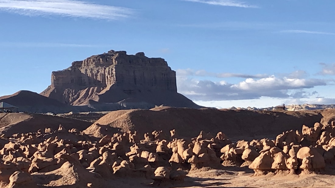 Mushroom shaped rock goblins spread across the desert floor at Goblin Valley State Park Utah