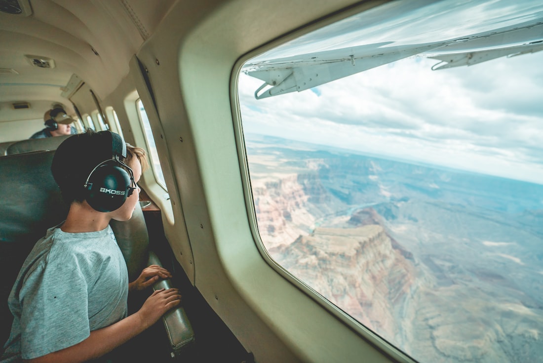 A small plane wing above red canyon country in southern Utah