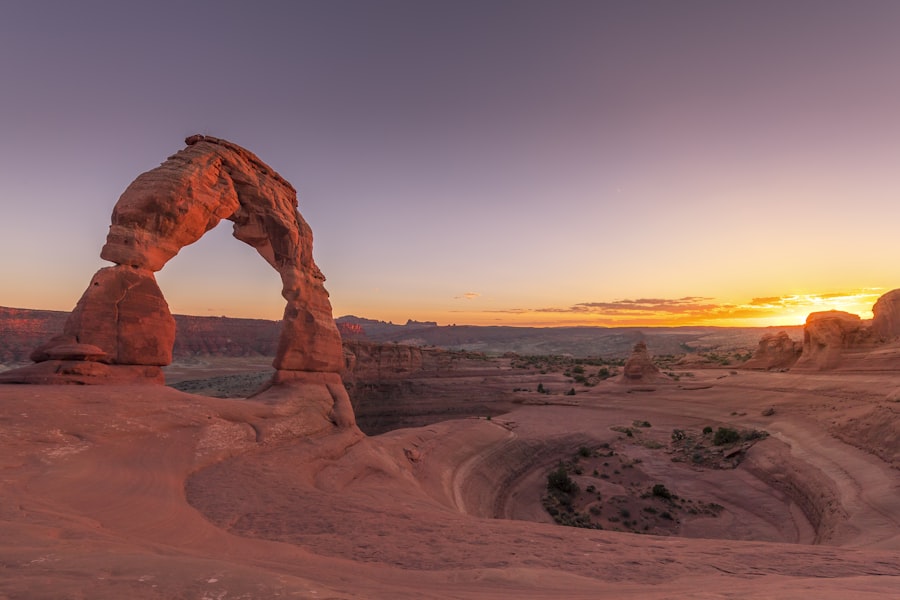 Delicate Arch standing alone on slickrock in Arches National Park near Moab Utah