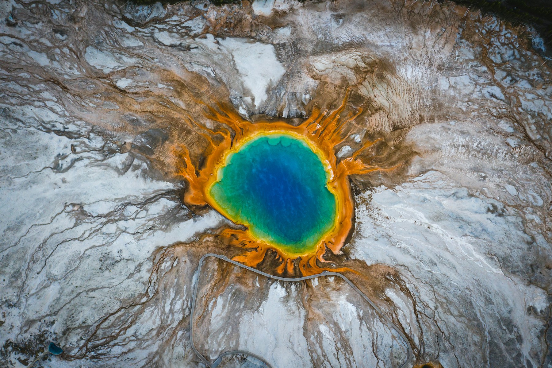 Grand Prismatic Spring from the air showing its blue centre ringed with orange and yellow