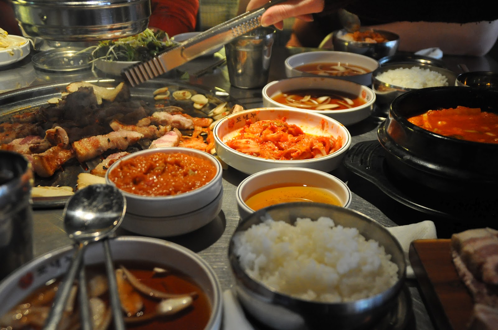 A spread of Korean banchan side dishes and rice
